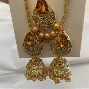 Gold yellow jhumka earrings and maanga tikka set